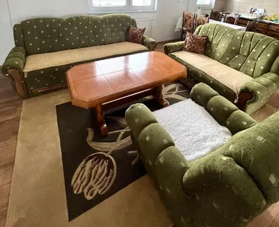 a living room with green couches and a coffee table at BIG Apartment 3 Bedrooms in Bihać