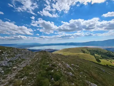a view from the top of a hill with a blue sky and clouds at Apartment Dolic - Your peaceful spot with a panoramic view in Livno