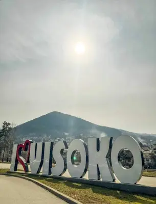 a sign with the wordyssopus on the side of a road at MB Deluxe Apartment in Visoko