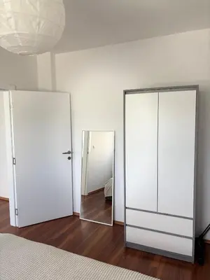 two mirrors in a room with a bed and a mirror at Lena in Jajce