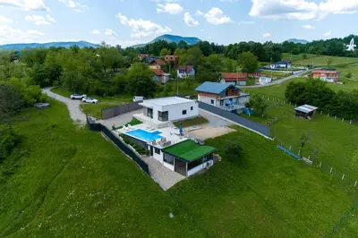 an aerial view of a house with a green roof at Villa Hill with Private Pool in Bosanska Krupa