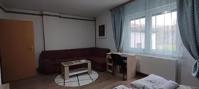 a living room with a couch and a table at Apartment Hatinac in Bihać