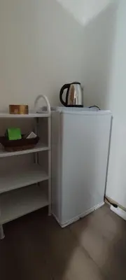 a white refrigerator with a tea kettle on top of it at Apartment Hatinac in Bihać