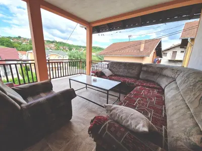 a living room with a couch and a table at Apartman Komfor in Banja Luka