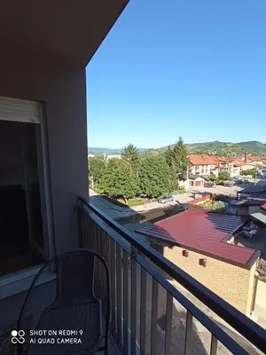 a balcony with a view of a building at Mercy Deluxapartment in Visoko