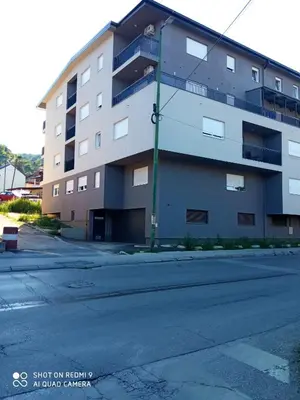 an empty street in front of a building at Mercy Deluxapartment in Visoko