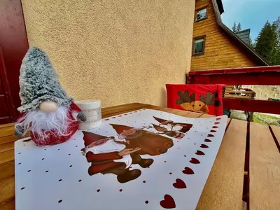 a table on a balcony with a picture on it at Villa 