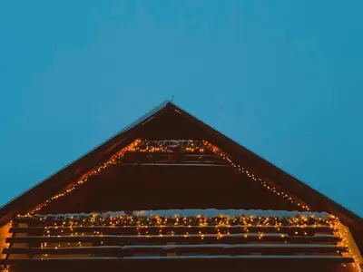 a group of people sitting on top of a building at Villa 