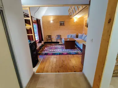 a living room with a couch and a table at Prokosko Resort in Fojnica