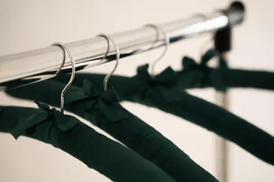 a group of green bows on a rack at Paradise in Bihać