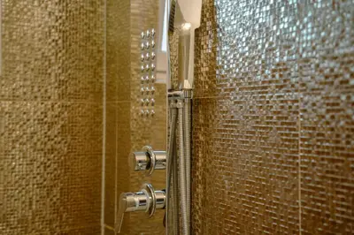 a shower stall with a glass door with a shower at Paradise in Bihać