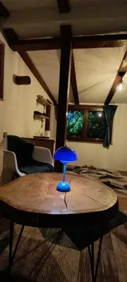 a blue stool sitting on top of a table in a room at RELAX HOME Visoko in Visoko