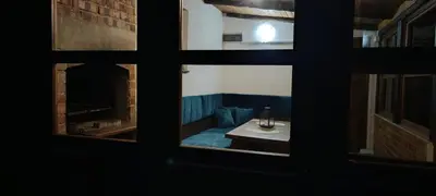 a view of a living room through a window at RELAX HOME Visoko in Visoko