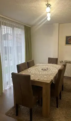 a dining room with a table and chairs at Apartment Sky in Visoko
