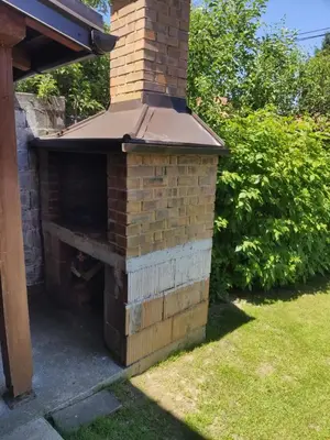 an outdoor brick oven in a yard at Apartment Sky in Visoko