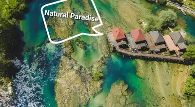 an aerial rendering of the natural parkridge estate on the shore of a lake at Natural Paradise in Bosanska Krupa
