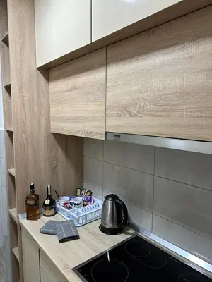 a kitchen counter with a sink and a tea kettle at Apartman Tamara in Doboj