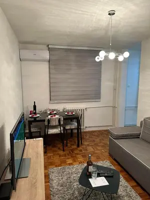 a living room with a couch and a table at Apartman Tamara in Doboj
