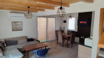 a living room with a couch and a table at Otoka Josikovic in Šipovo