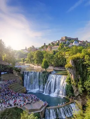 a group of people standing in front of a waterfall at Otoka Josikovic in Šipovo