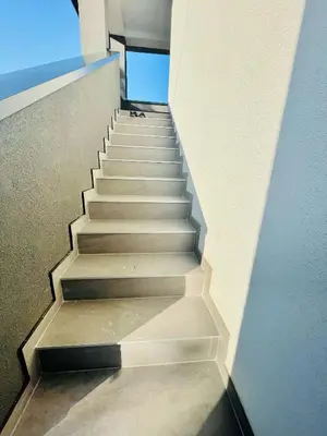 a stairway in a building with a stair case at Ammirevole Ravne Apartments in Visoko