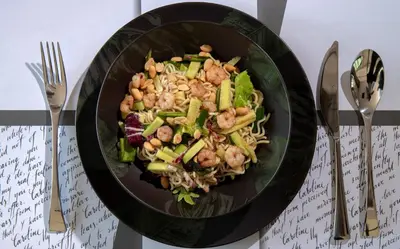 a black bowl of food on a table at Resort Una Park in Bihać