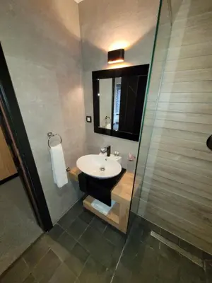 a bathroom with a sink and a shower at Motel Bihać in Bihać