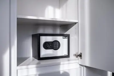 a door with a safe in a room at Royal Residence Deluxe Apartments in Bihać