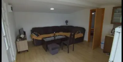 a living room with a couch and a table at ''Lake House Jana'' Ramsko Jezero in Prozor