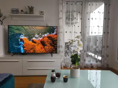 a living room with a flat screen tv at Apartment M & N in Banja Luka