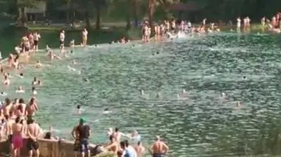 a group of people swimming in a body of water at Paulinio in Jajce