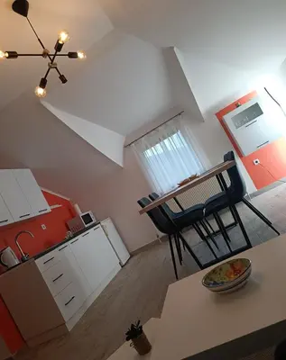 an overhead view of a kitchen with a table and chairs at Villa Nana in Kulen Vakuf