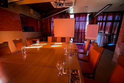 a large conference room with a long table and chairs at Hotel Fortuna in Banja Luka