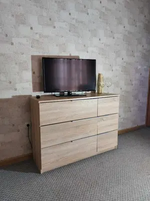 a television on top of a wooden dresser at Motel Bajra in Travnik