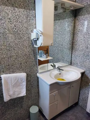 a bathroom with a sink and a mirror at Motel Bajra in Travnik