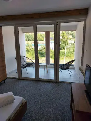 a room with sliding glass doors with a patio at Motel Bajra in Travnik