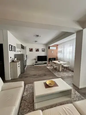a living room with a couch and a table at Apartmani Gandi in Bihać