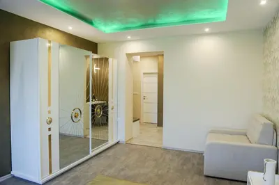 a living room with a couch and a glass door at Apartmani President V in Banja Luka