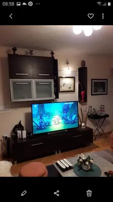 a living room with a large flat screen tv at Holiday home Veky in Kupres