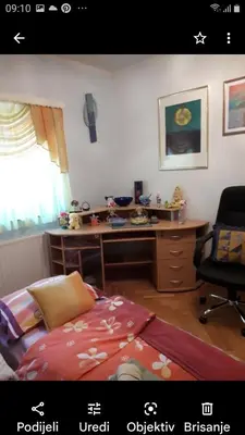 a bedroom with a desk and a bed in a room at Holiday home Veky in Kupres