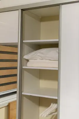 a closet door with a bed in it at Sobe Mili Ozren in Doboj