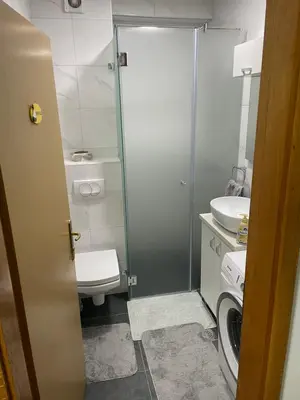 a small bathroom with a toilet and a sink at Lara in Banja Luka