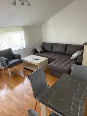 a living room with a couch and a table at Lara in Banja Luka