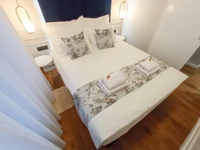 a bedroom with two beds with white sheets and pillows at Premium Apartmani Banja Luka in Banja Luka
