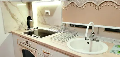 a bathroom counter with a sink and a mirror at Lux Apartment ll Prijedor in Prijedor