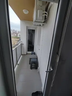 an empty corridor of a room with a balcony at Stan na dan Apartman KRISFIL Prnjavor in Prnjavor