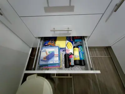 a bathroom with a pantry in the ceiling at Stan na dan Apartman KRISFIL Prnjavor in Prnjavor