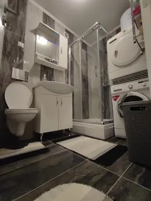 a bathroom with a toilet and a shower at Stan na dan Apartman KRISFIL Prnjavor in Prnjavor