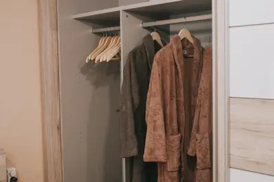 a closet with coats hanging in it at Take it easy Apartment in Visoko