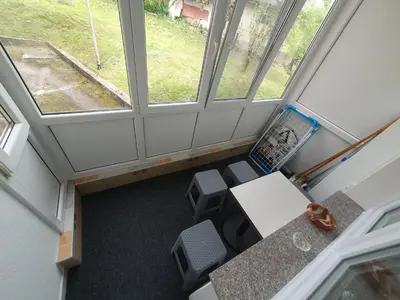 an overhead view of a office with a desk and a laptop at Stan u centru Prnjavor in Prnjavor